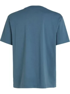 T-shirt en coton bleu uni à coupe oversize avec un patch logo cousu à l'avant