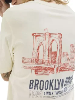 T-shirt en coton écru avec un imprimé une coupe droite et un col rond
