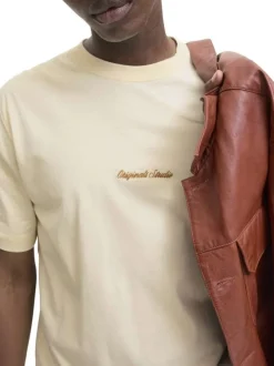 T-shirt en coton écru uni avec un col rond et des manches courtes