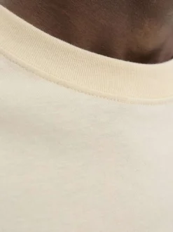 T-shirt en coton écru uni avec un col rond et des manches courtes