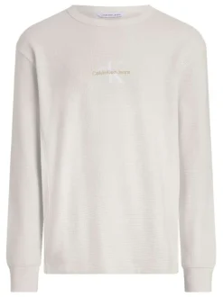 T-shirt en coton écru uni avec un col rond et des manches longues