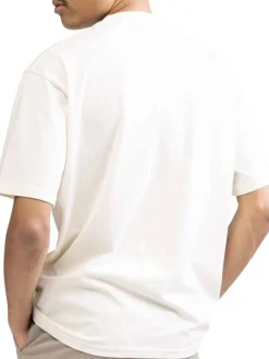 T-shirt en coton écru uni avec une coupe droite et un col rond