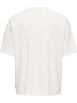 T-shirt en coton écru uni avec une coupe oversize et un col rond