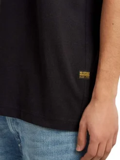 T-shirt en coton noir imprimé avec logo iconique et une coupe droite