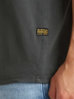 T-shirt en coton noir uni avec un col rond et une coupe droite
