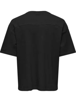 T-shirt en coton noir uni avec une coupe oversize et un col rond