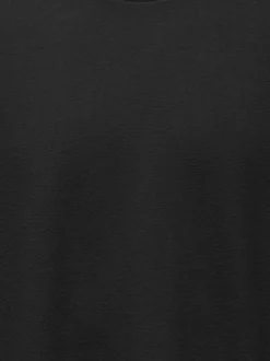 T-shirt en coton noir uni avec une coupe oversize et un col rond
