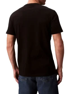 T-shirt en coton noir uni avec un petit patch brodé et à col rond