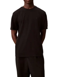 T-shirt en coton noir uni à col rond avec le mini logo brodé à la poitrine