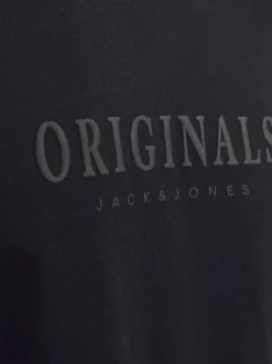 T-shirt en coton noir uni à coupe droite avec une écriture en relief