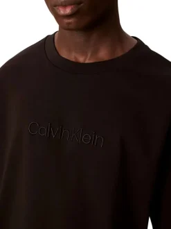 T-shirt en coton noir uni à coupe oversize avec le nom de la marque brodé