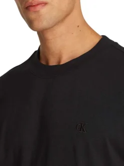 T-shirt en coton noir uni à coupe oversize avec un imprimé logo à l'arrière
