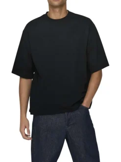 T-shirt en coton noir uni épais avec une coupe très oversize et un col rond