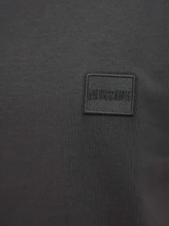 T-shirt en coton noir uni pourvu d'un col rond et de manches courtes