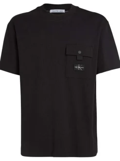 T-shirt en coton noir uni texturé avec un col rond et une coupe droite