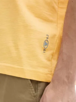 T-shirt en coton orange rayé à col rond avec une petite poche à la poitrine