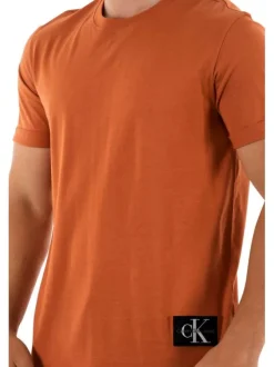 T-shirt en coton orange uni avec patch d'authentification cousu