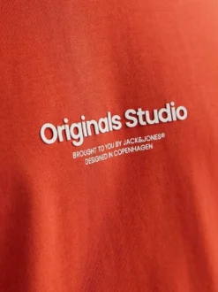 T-shirt en coton orange uni avec une coupe droite à col rond et nom iconique