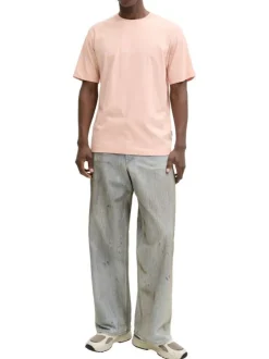 T-shirt en coton rose pourvu d'un col rond et de manches courtes