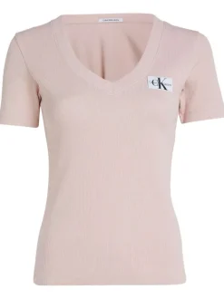 T-shirt en coton rose uni avec une coupe droite un col v et logo à l'avant