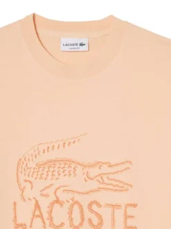 T-shirt en coton saumon à coupe droite pourvu d'un col rond texturé