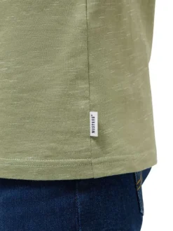 T-shirt en coton vert à motifs moucheté avec une coupe droite et un col rond
