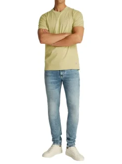 T-shirt en coton vert tilleul uni avec un col rond et un petit patch écru