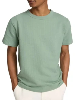 T-shirt en gaze de coton vert uni avec un col rond et une coupe droite