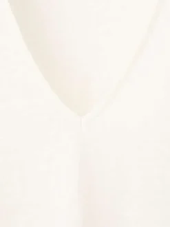 T-shirt en lin blanc uni pourvu d'une coupe droite et d'un col v