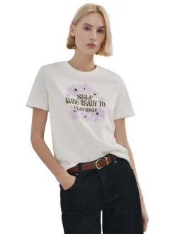 T-shirt en lin écru uni pourvu d'une coupe droite et d'un col rond
