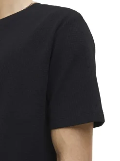 T-shirt à manches courtes noir uni avec une coupe droite et un col rond