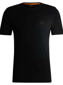 T-shirt noir uni à coupe droite et à col rond avec un petit patch carré