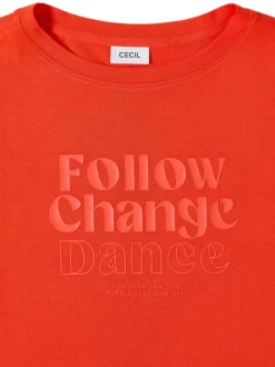 T-shirt orange uni pourvu de manches courtes et d'un col rond