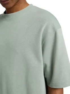 T-shirt épais vert chiné avec une coupe oversize et un col rond
