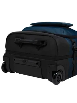 Valise bleue unie à roulettes pourvue d'une fermeture zippée et à code