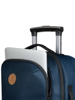 Valise bleue unie à roulettes pourvue d'une poignée télescopique