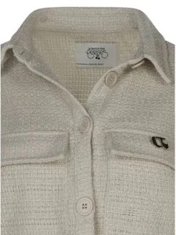 Veste beige unie pourvue d'une coupe droite et de manches longues