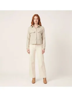 Veste beige unie pourvue d'une coupe droite et de manches longues