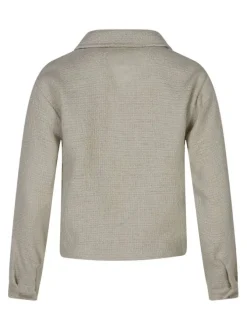 Veste beige unie pourvue d'une coupe droite et de manches longues