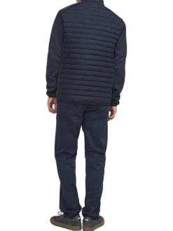 Veste bleue marine matelassée avec une coupe droite et un col montant à zip