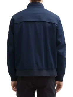 Veste bleue marine unie avec un col montant et des poches à rabat