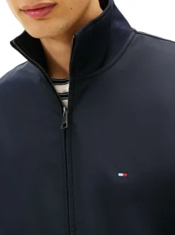 Veste en coton marine pourvue d'une coupe ajustée et d'un col montant zippé